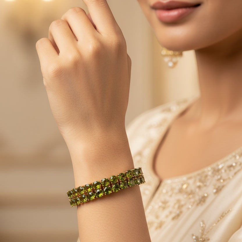 SVORA Emerald Double Row Tennis Bracelet with gold plating and green cubic zirconia stones.