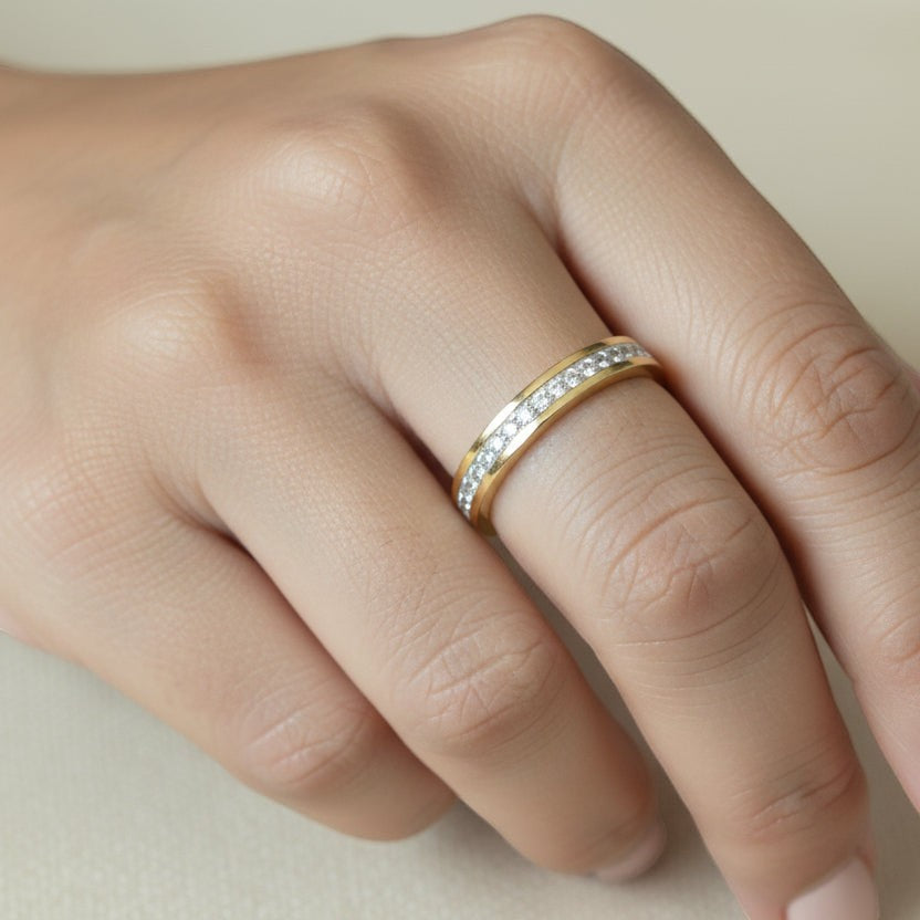 SVORA gold plated stainless steel Lumiere Stack Eternity Ring with full circle pavé stones, worn on a finger.