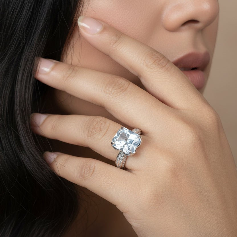 SVORA Ethereal Botanica Solitaire Ring with a princess-cut clear stone and leaf-motif band, made of rhodium-plated stainless steel.