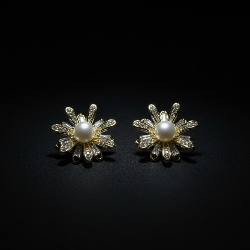 SVORA flower bloom pearl stud earrings with gold plating and sparkling crystals.