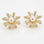 SVORA gold flower bloom pearl stud earrings with pavé and baguette crystals