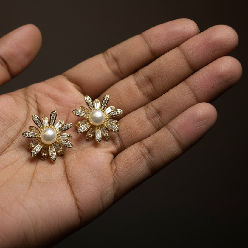 SVORA gold flower bloom pearl stud earrings with pavé and baguette crystals