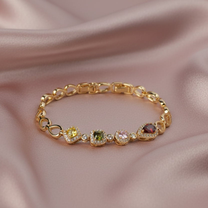 SVORA geometric multicolor bracelet with citrine yellow, peridot, pink, and garnet CZ stones set in gold.