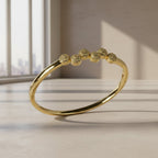 SVORA gold plated stainless steel bangle bracelet with six pavé cubic zirconia domes. Modern, waterproof jewelry.