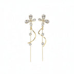 SVORA gold tone stainless steel dangle earrings with cubic zirconia butterfly tops and dual chains.