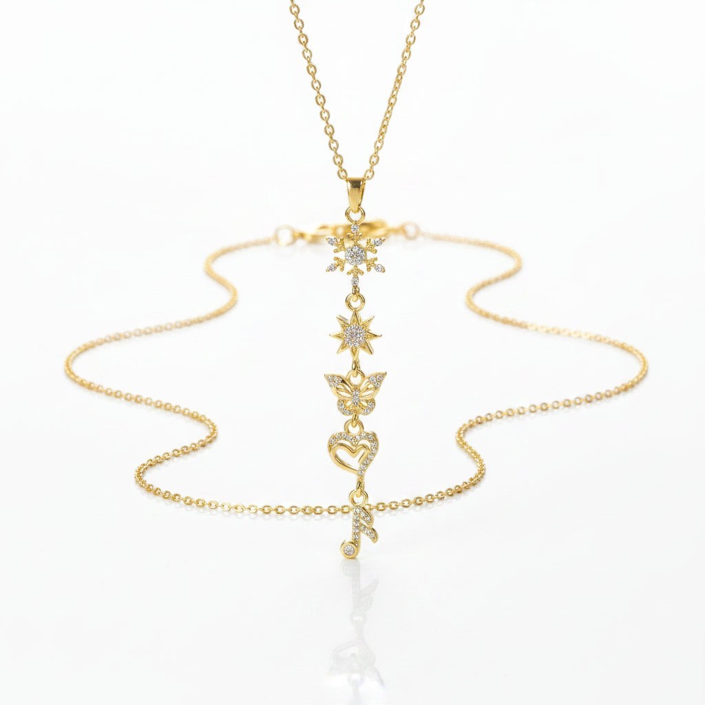 SVORA gold plated stainless steel necklace with snowflake, star, butterfly, heart, and music note charms.
