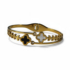 SVORA gold-plated stainless steel bracelet with black onyx and white mother-of-pearl clover charms and clear crystals.