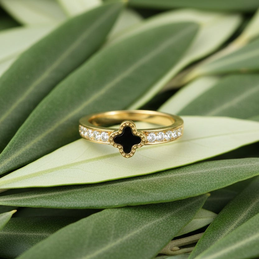 SVORA gold clover ring with black center and clear crystals on band, 18K gold plated stainless steel