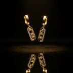 SVORA gold tone dangle earrings with three cubic zirconia stones channel-set in a pavé bar. Sophisticated, versatile design.