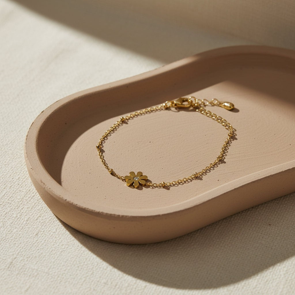SVORA gold plated stainless steel daisy solitaire chain bracelet with cubic zirconia stone, adjustable lobster clasp.