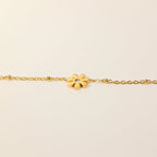 SVORA gold-plated stainless steel daisy chain bracelet with a clear cubic zirconia stone. Adjustable lobster clasp.