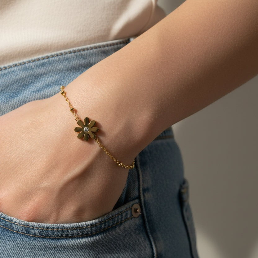SVORA gold daisy solitaire chain bracelet with cubic zirconia center on a beaded chain, adjustable with lobster clasp.
