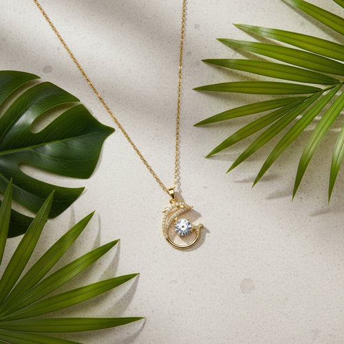 SVORA gold-plated stainless steel necklace with a pavé crystal dolphin pendant and a large white CZ.