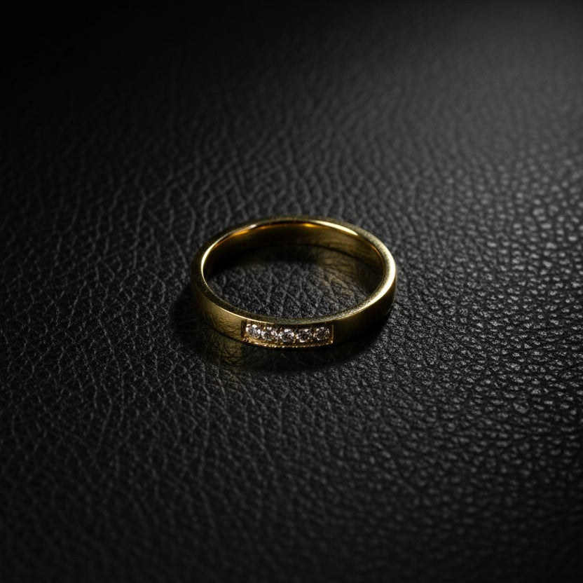 SVORA gold five stone ring with channel-set diamonds on a slim band, made of 18K gold plated stainless steel.