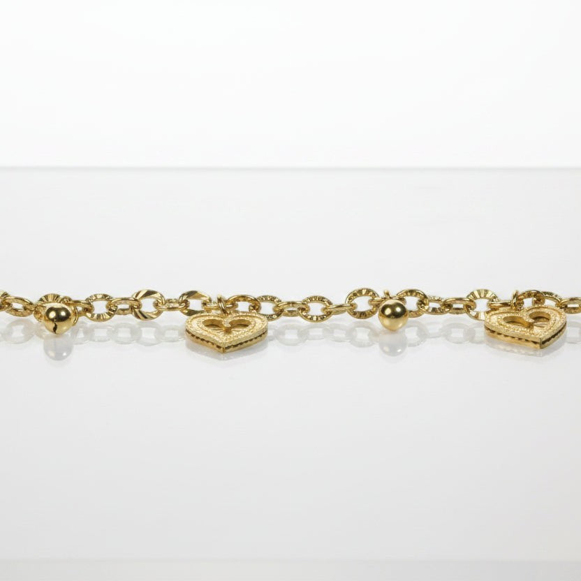 SVORA gold cable chain bracelet with three heart charms and gold beads. 18K gold plated, stainless steel.