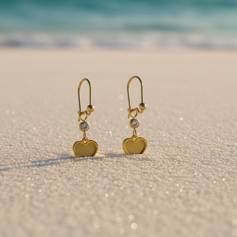 SVORA gold tone stainless steel dangle earrings with cubic zirconia studs and heart charms, perfect for daily wear.