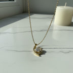 SVORA gold plated stainless steel necklace with a heart-shaped pendant featuring a clear crystal and small accent crystals.