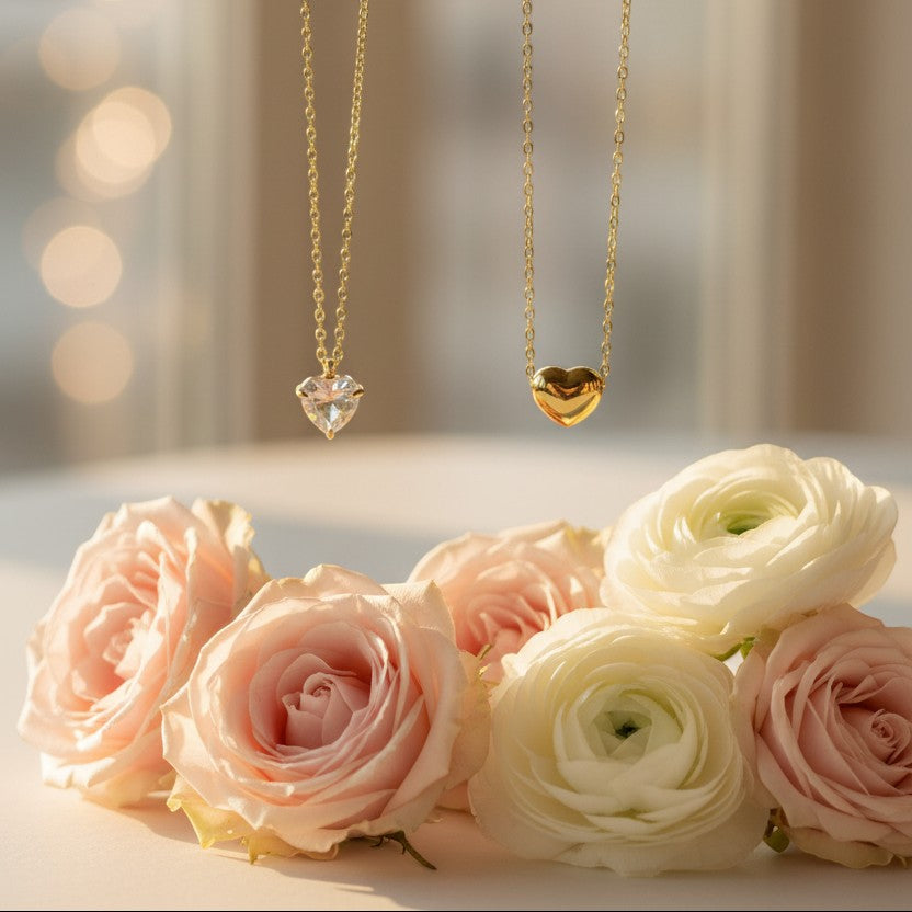 SVORA gold-plated stainless steel necklace with a heart-cut cubic zirconia pendant and a solid gold heart pendant.