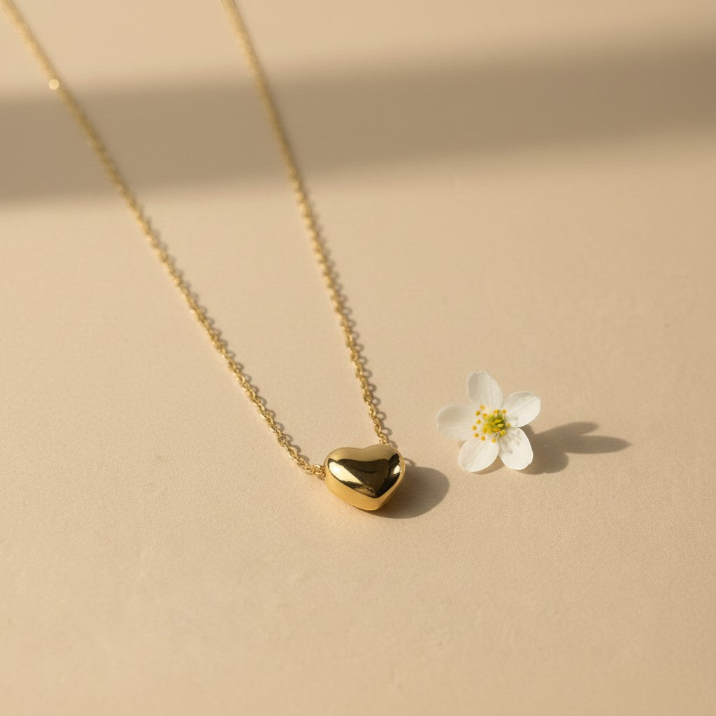 SVORA gold puffy heart pendant necklace made of stainless steel with 18k gold plating.