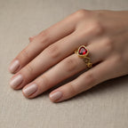 SVORA gold-plated stainless steel ring with a red heart-shaped cubic zirconia and heart cutouts.