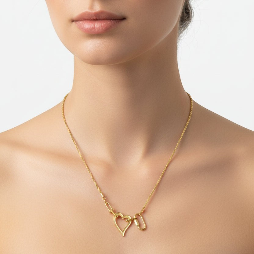 SVORA gold-tone stainless steel open heart rope statement necklace with toggle clasp.