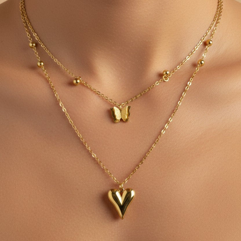 SVORA gold-tone stainless steel layered necklace with puffy heart and butterfly charms.