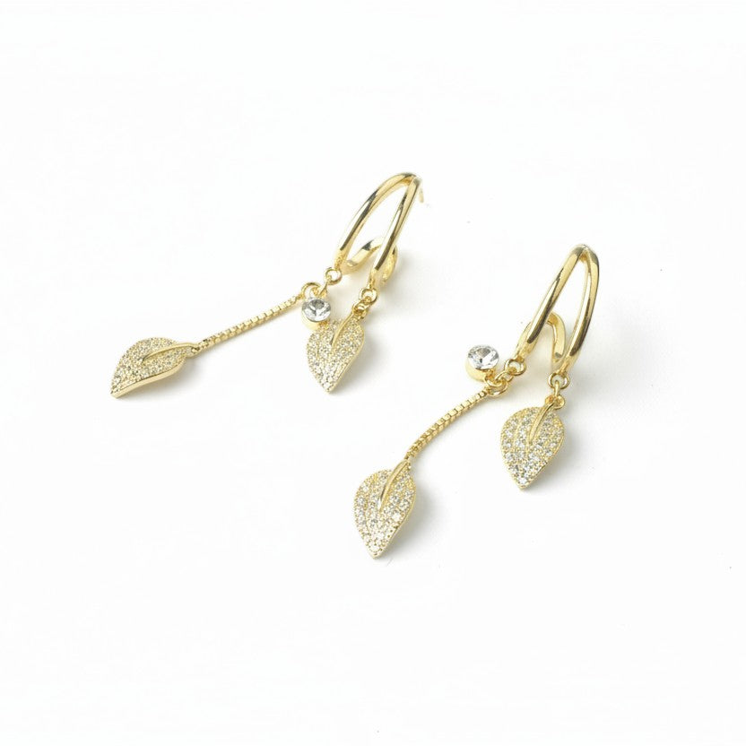 SVORA gold-plated stainless steel dangle earrings with pave crystal leaf charms and round crystal studs.
