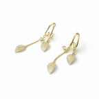 SVORA gold-plated stainless steel dangle earrings with pave crystal leaf charms and round crystal studs.