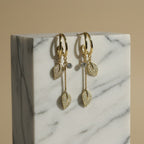 SVORA gold-plated stainless steel dangle earrings with pave crystal leaf charms and round crystal studs.