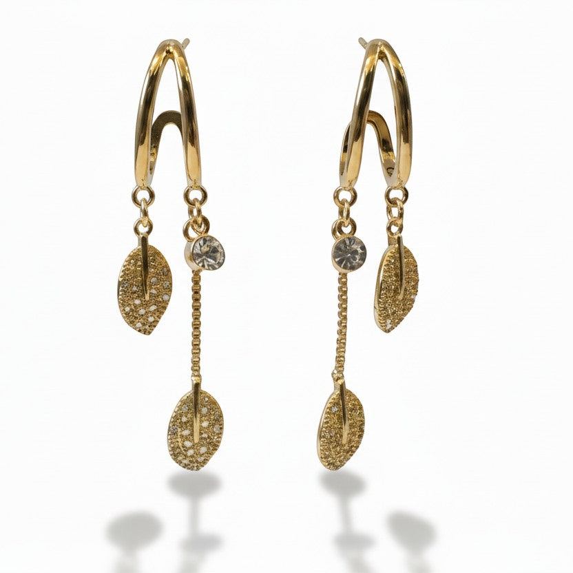 SVORA gold-plated stainless steel dangle earrings with crystal studs and pave leaf charms.