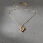 SVORA gold plated stainless steel necklace with a blush marquise leaf pendant adorned with pink and white CZ stones.