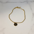 SVORA gold ball bead chain bracelet with black monogram disc, adjustable lobster clasp, 18K gold plated stainless steel.