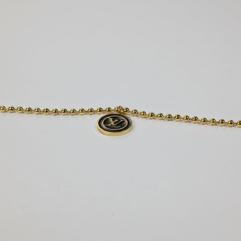 SVORA gold ball bead chain bracelet with black monogram disc pendant. 18K gold plated, waterproof.
