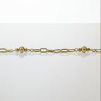 SVORA gold paperclip chain bracelet with three small gold beads spaced along it. 18K gold plated stainless steel.