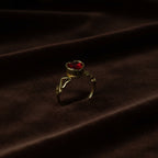 SVORA gold-plated stainless steel ring with a red heart-shaped cubic zirconia and heart details on the band.
