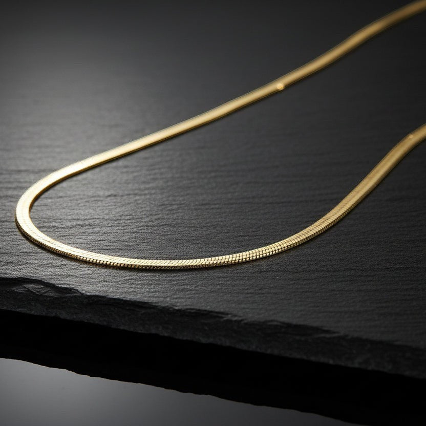 SVORA gold snake chain necklace, 18K gold plated stainless steel, smooth and flexible herringbone design.