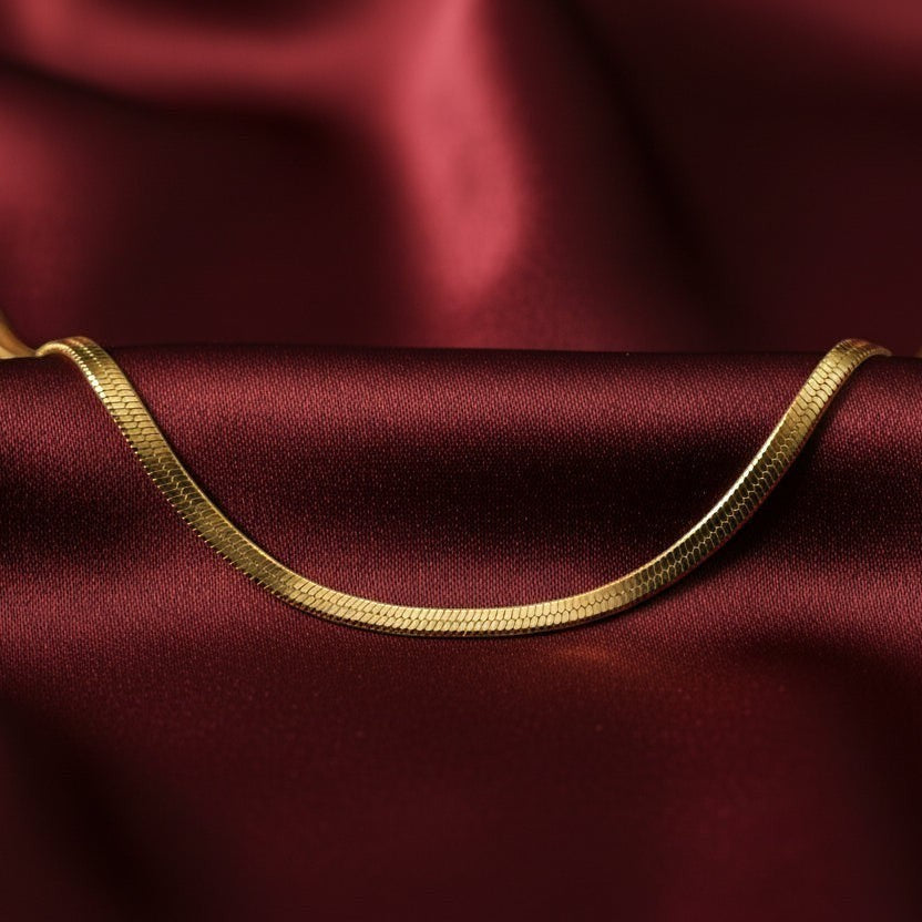 SVORA gold flat herringbone snake chain necklace made of 18K gold plated stainless steel.