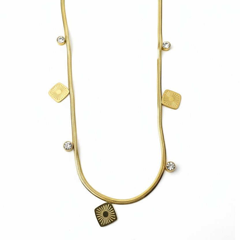 SVORA gold snake chain necklace with square charms and clear stones. Stainless steel, 18k gold plated.