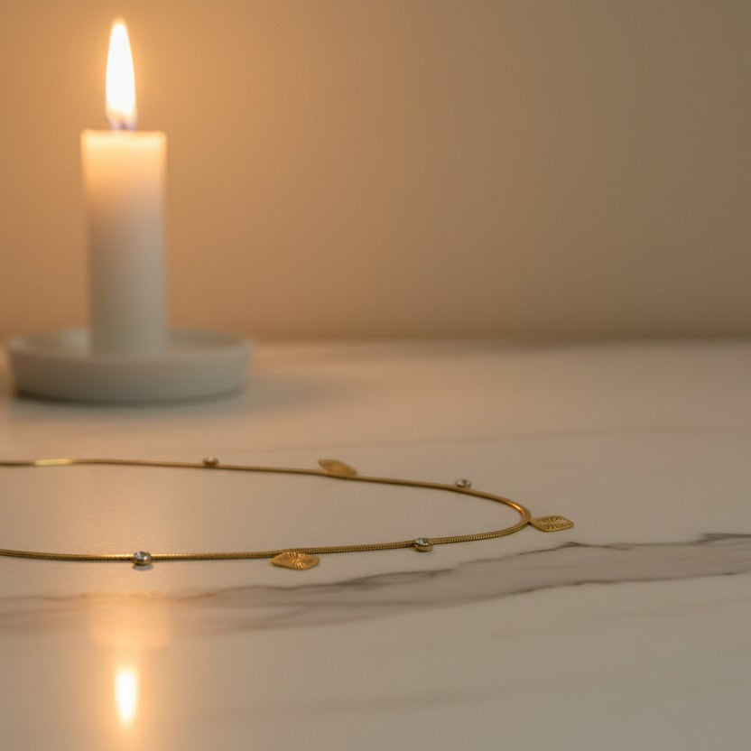 SVORA gold snake chain necklace with square charms and clear stones. 18k gold plated stainless steel.