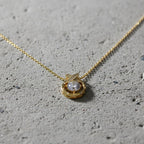 SVORA gold plated stainless steel necklace with solitaire CZ and pavé butterfly detail.