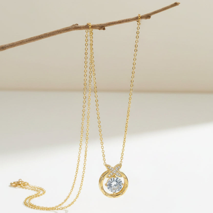 SVORA gold plated stainless steel pendant necklace with solitaire CZ and pavé butterfly detail.