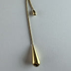 SVORA gold teardrop lariat necklace with adjustable snake chain and polished teardrop charms.