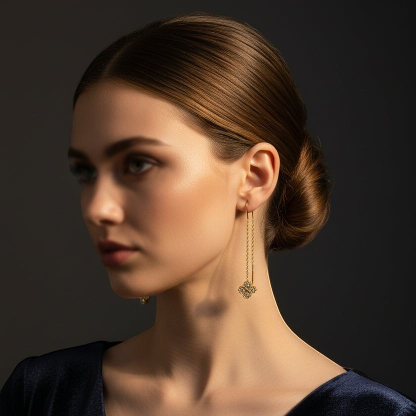 SVORA gold tone stainless steel thread-through earrings with cubic zirconia clover detail