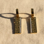 SVORA gold-tone stainless steel drop earrings with Greek key cut-out and pavé cubic zirconia detail.