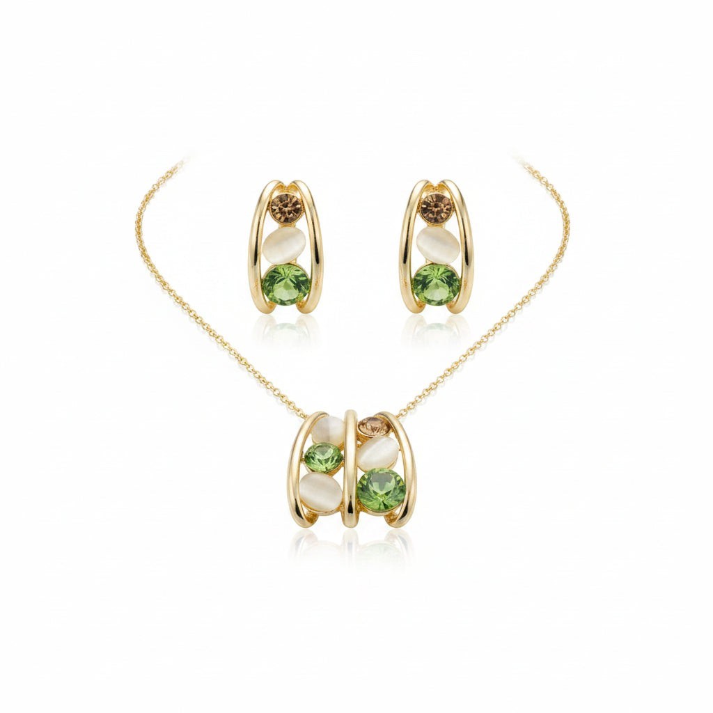 SVORA gold tone necklace and earrings set with green crystal, peach, and cream cabochon stones in a caged design.