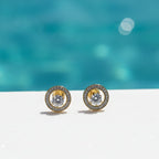 SVORA Halo Solitaire Stud Earrings with round cubic zirconia center framed by pavé halo, 18K gold tone.