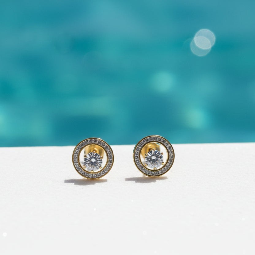 SVORA Halo Solitaire Stud Earrings with round cubic zirconia center framed by pavé halo, 18K gold tone.