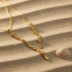 SVORA gold plated stainless steel Hamsa Talisman Charm Necklace with star and eye details on a fine chain.