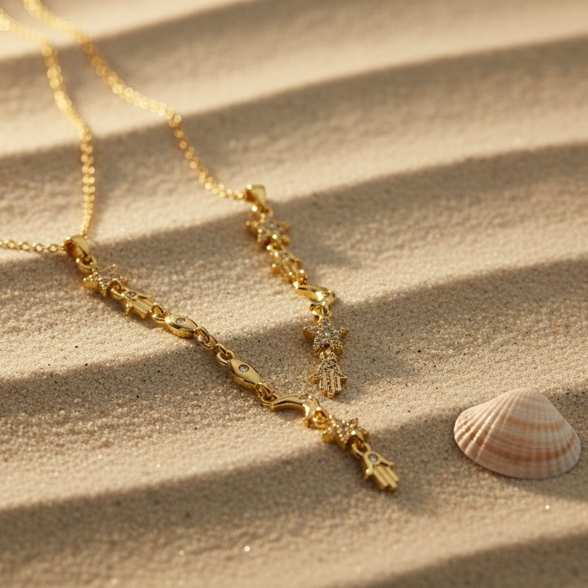 SVORA gold plated stainless steel Hamsa Talisman Charm Necklace with star and eye details on a fine chain.