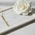 SVORA gold plated stainless steel Hamsa Talisman Charm Necklace with star and moon charms.